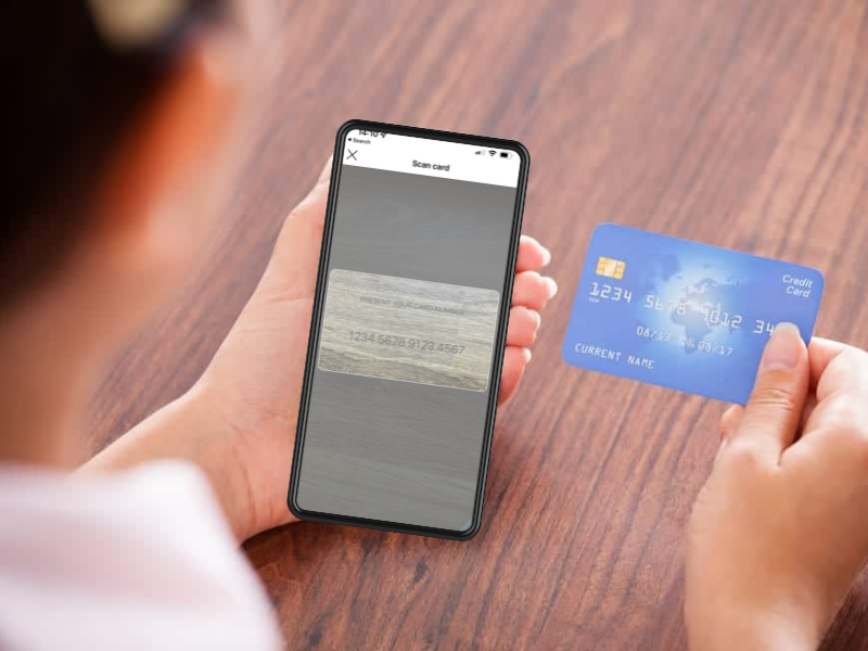 picture of lady using SimplyPayMe's virtual card scan payment on phone